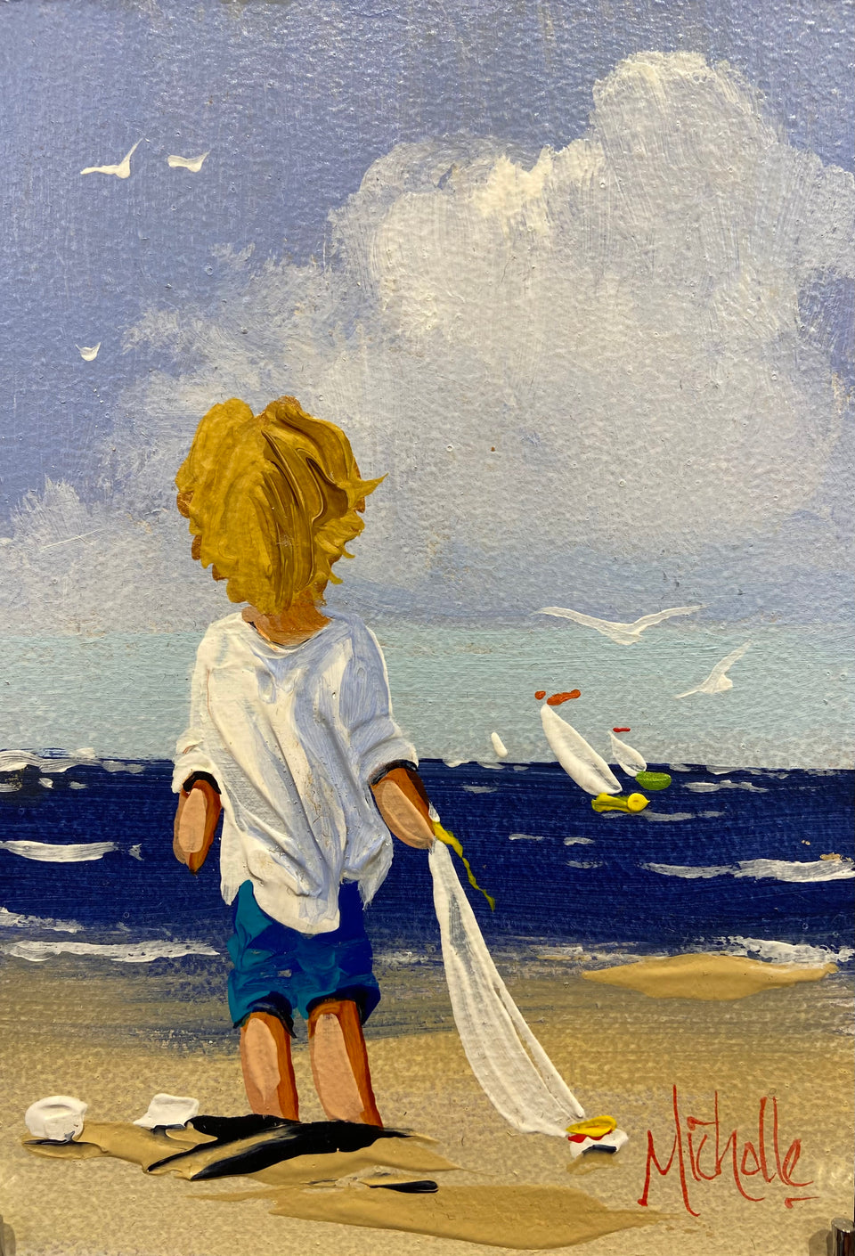 Young Boy With His Toy Sailboat
